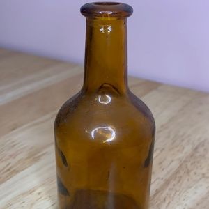 Small brown glass jar